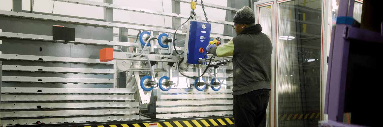 Cardinal Employee working with a robot Cardinal Employee working with a robot